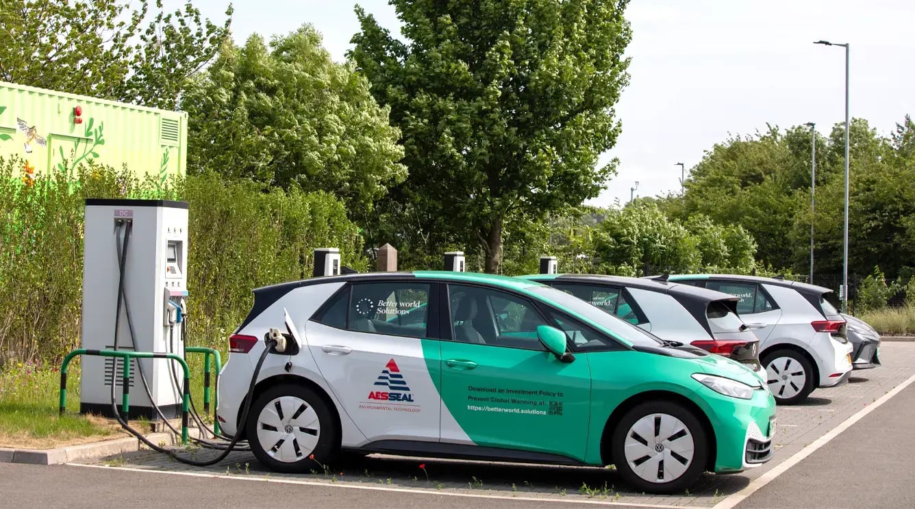AESSEAL Betterworld electric car charging in a car park.