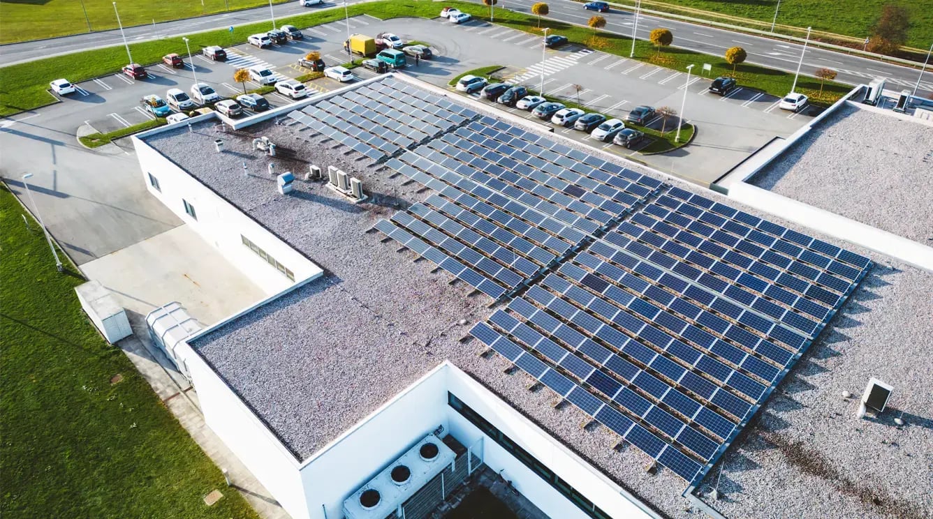 Solar panels on a commercial building roof.