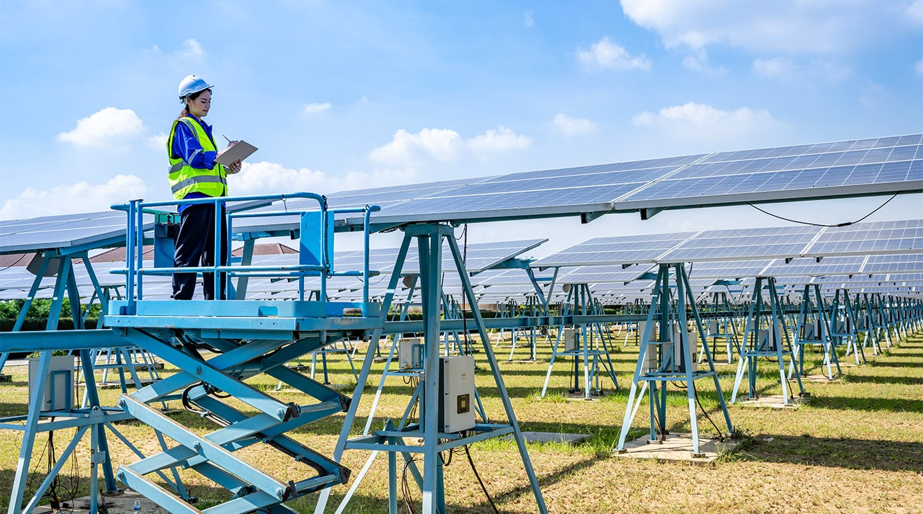 Staff working on Solar Panels