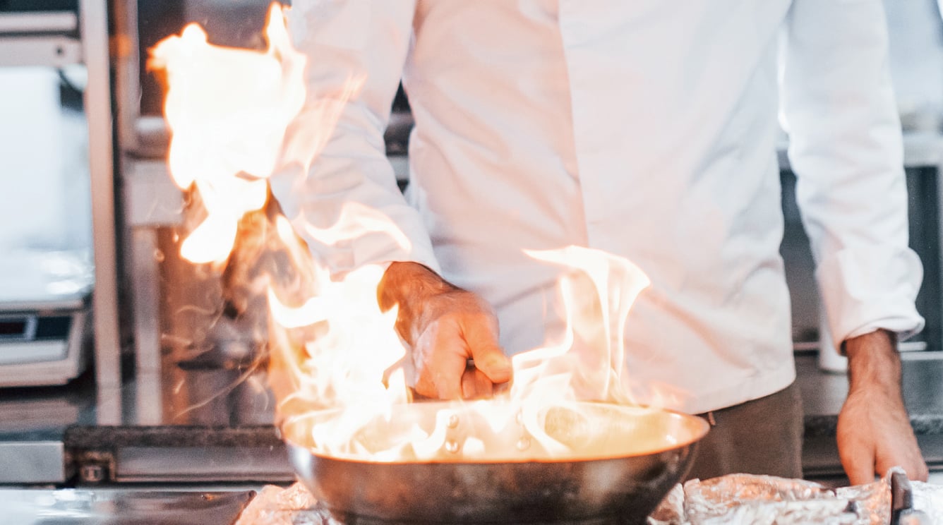 frying-pan-is-on-fire-chef-in-white-uniform-cooki-2025-03-18-20-05-53-utc frying-pan-is-on-fire-chef-in-white-uniform-cooki-2025-03-18-20-05-53-utc
